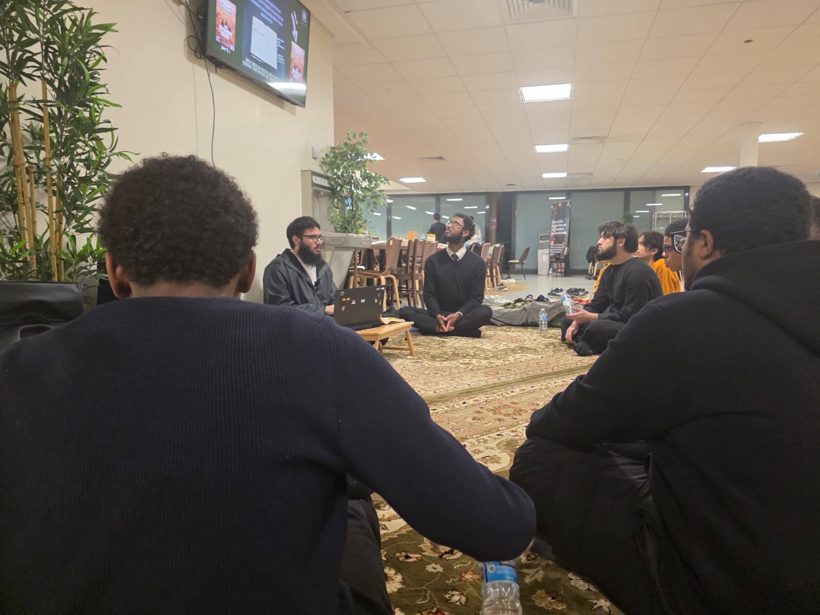 Students gathered in a circle of knowledge